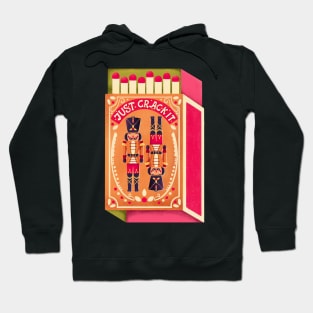 Two colorful nutcrackers on a matchbox with hand lettering on a pink background. Colorful festive winter Merry Christmas illustration Hoodie